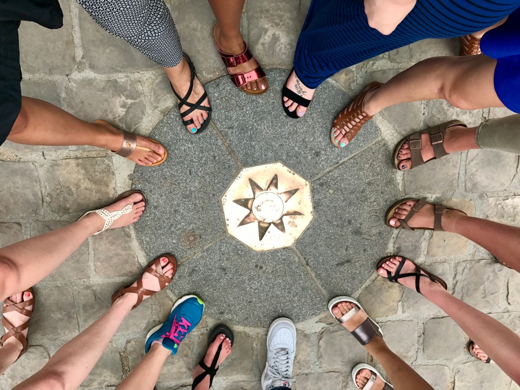 Students' feet around Point Zero, the center of Paris